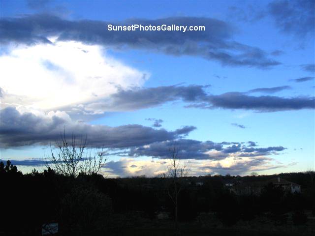 Sunrise with white and blue clouds and bright blue sky color - Quiet rural Nebraska Midwest area