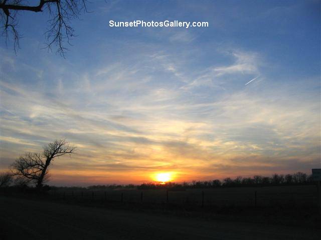 Colorful clouds - Red, orange and blue color sky - Beautiful Rural Sunset +Â one jet trail - Sunset Photos Gallery